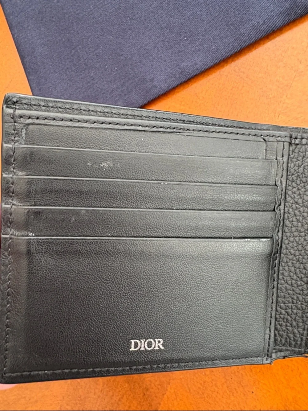 Christian Dior icon bifold wallet. Black grained calfskin